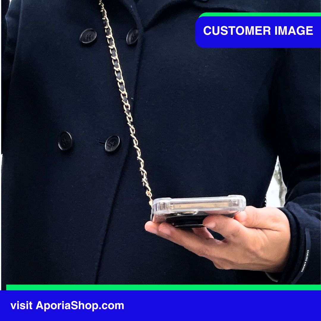 Image of a customer in navy blue trench coat using Aporia MagSafe Clear Case - Luxury Crossbody Strap for iPhone 15/14/13/12