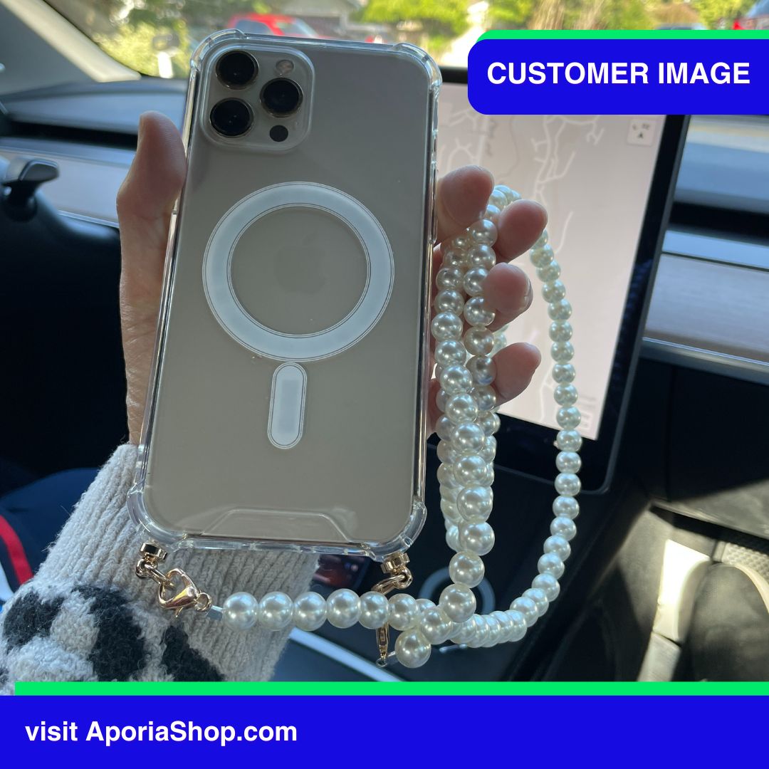 Image of a customer holding the Aporia Magsafe Clear Case - Pearl Crossbody Strap for iPhone 15/14/13/12 inside Tesla Car