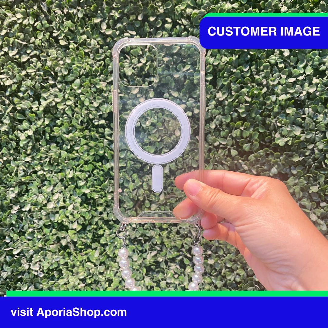 Image of customer holding Aporia MagSafe Clear Case - Pearl Wristlet Strap for iPhone 15/14/13/12