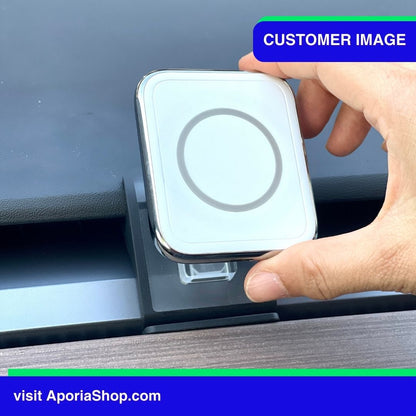 Image of customer holding MagSafe Wireless Charger Tesla Mount Air Vent inside Tesla