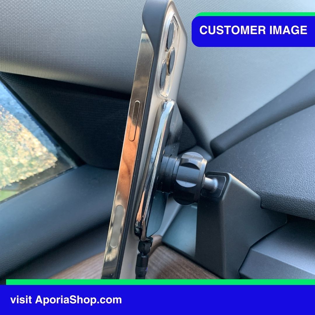 Image of customer using MagSafe Wireless Charger Tesla Mount with iPhone