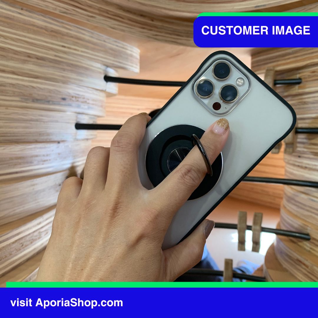 Image of customer holding MagSafe Magnetic Ring Finger Grip Holder with iPhone
